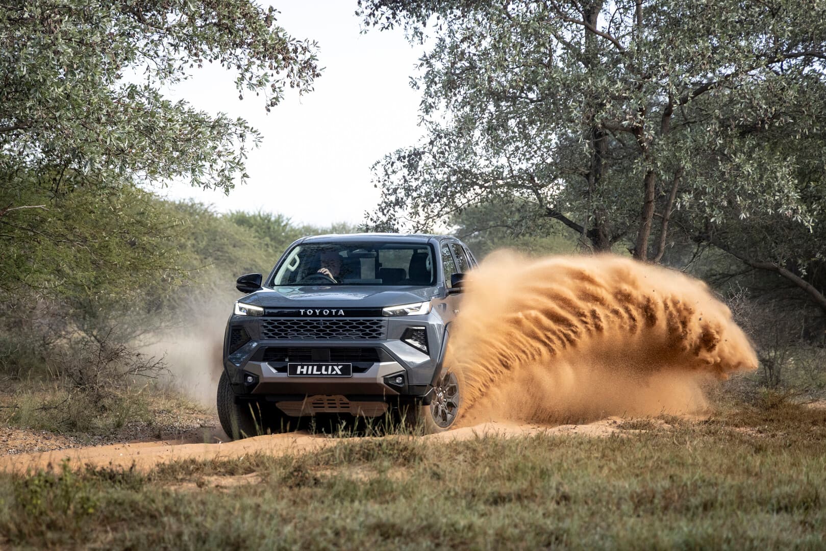 New-Generation Toyota Hilux powering through the mud
